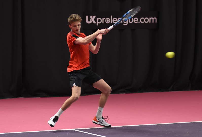 Tennis player George Houghton in action.