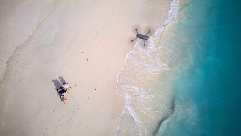 Mel and team flying a drone in the Maldives.