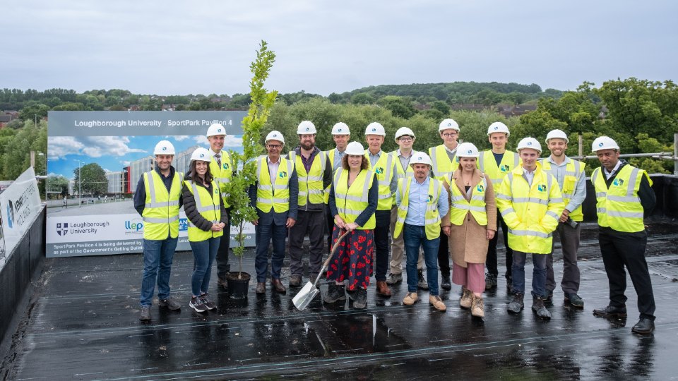 Representatives from Loughborough University, SportPark Pavilion 4 project team, Leicester and Leicestershire Enterprise Partnership and UK Anti-Doping at the topping out ceremony. The oak tree will be planted in the grounds of SportPark, adding to the established native species of tree and hedgerow.