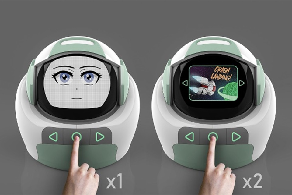 Orbit the robot, an interactive robot that aims to teach children with autism spectrum disorders (ASD) about emotions and social appropriateness through storytelling, physical interaction, and visual communication. Pictured is Orbit being pressed by a hand, the face changes from an animated face to a picture of a rocket. 