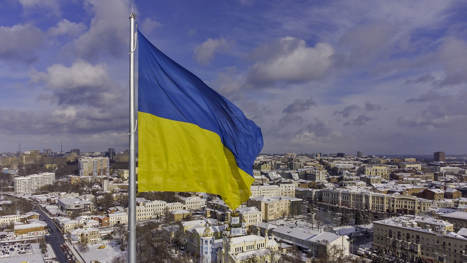 Ukrainian flag flying over city
