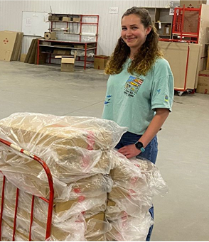 girl stands in warehouse