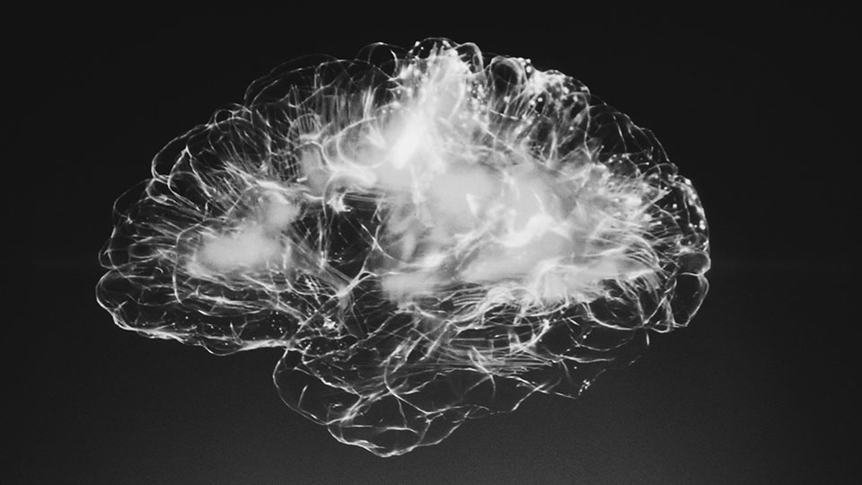 A glowing, abstract representation of a human brain with visible neural pathways on a dark background.