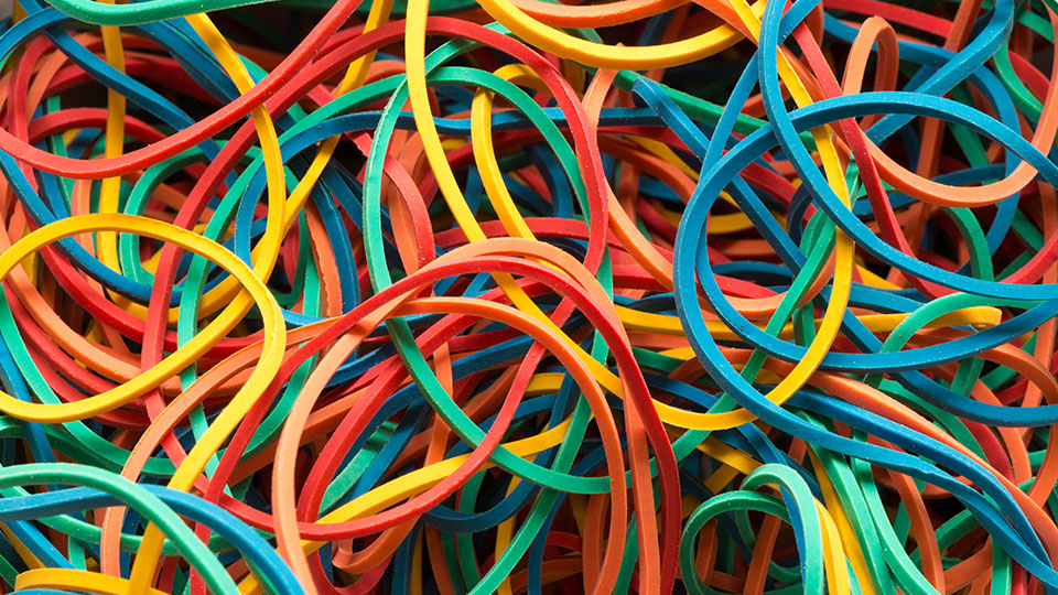 Close-up of colourful rubber bands.