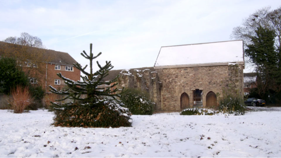 photo of a church and trees in the snow