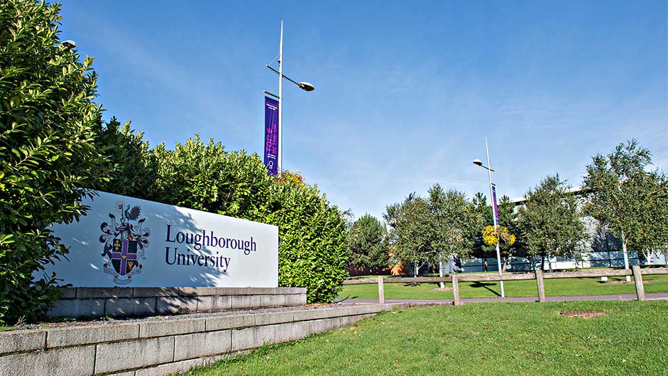 Front entrance of the university with logo sign
