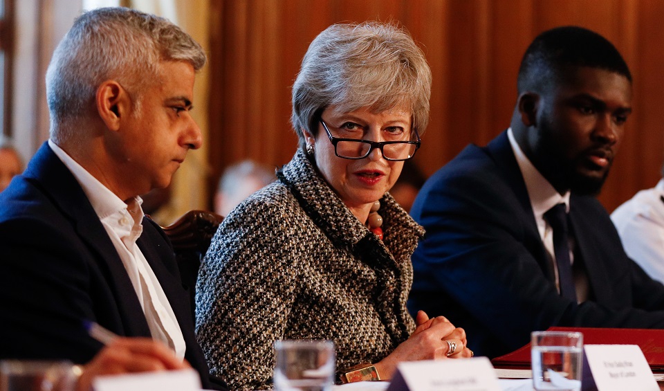 Student Roy Sefa-Attakora is pictured at the youth crime summit with Prime Minister Theresa May and Mayor of London Sadiq Khan.