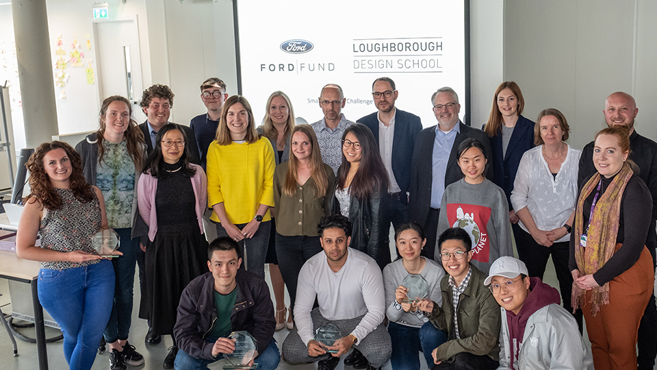 photo of students, academics and Ford Ford representatives at presentation event