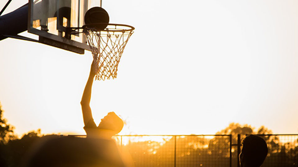 basketball played at dusk 