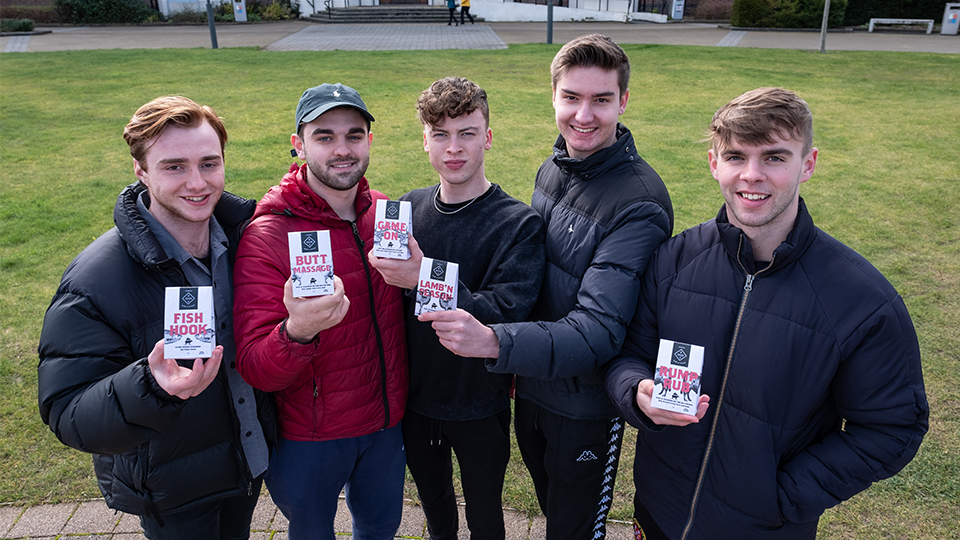 Photo of five students in the team stood outside the Hazlerigg/Rutland Fountain holding BOHNS products