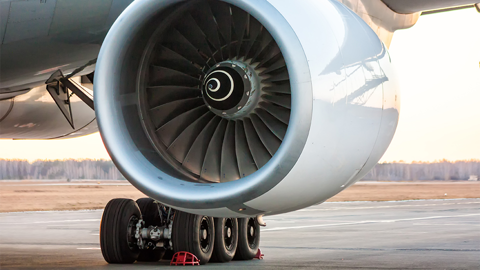 Photo of a close-up of a plane engine on a runway