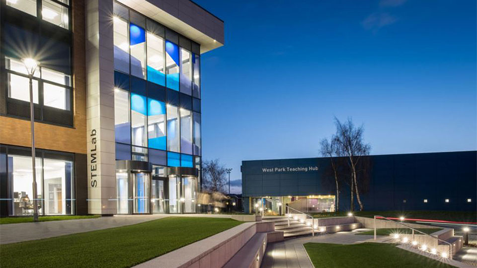 Photo of exterior of STEMLab and West Park Teaching Hub in the dark