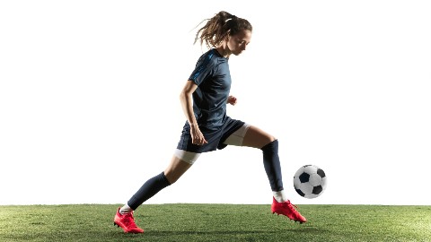a woman playing football 
