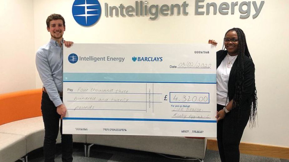 Photo of Intelligent Energy presenting a cheque to Ruby Appiah-Campbell/Life Beacon