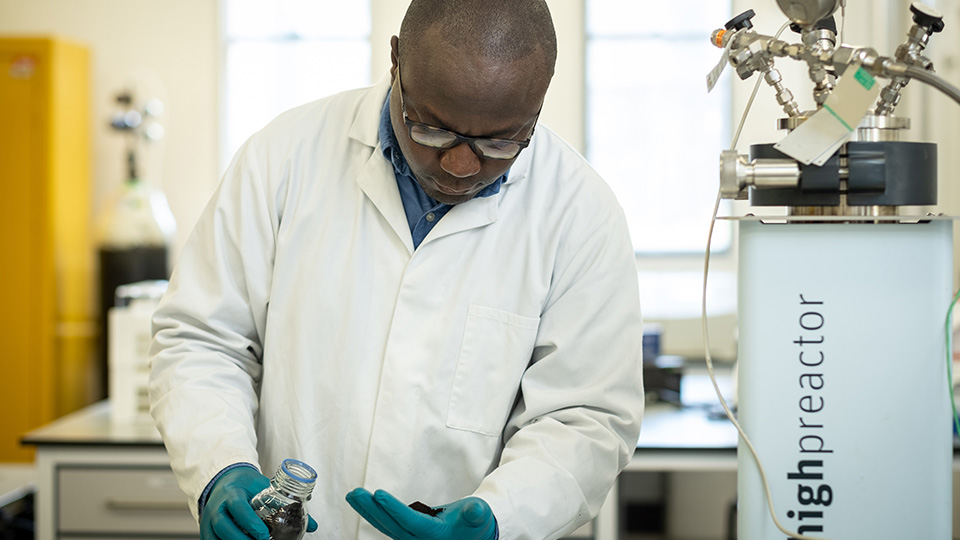 Photo of Dr Sola Afolabi in a lab environment 