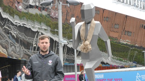 Loughborough para athlete Ben Pearson alongside the One Giant Leap For Humankind sculpture by artist Jacob Chandler.

