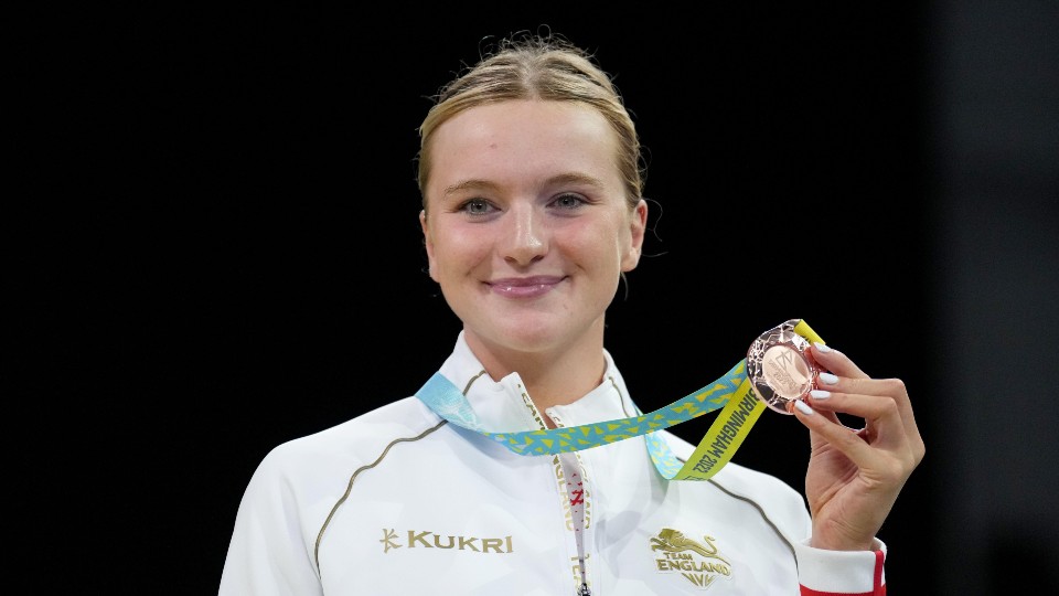 an athlete holding a medal
