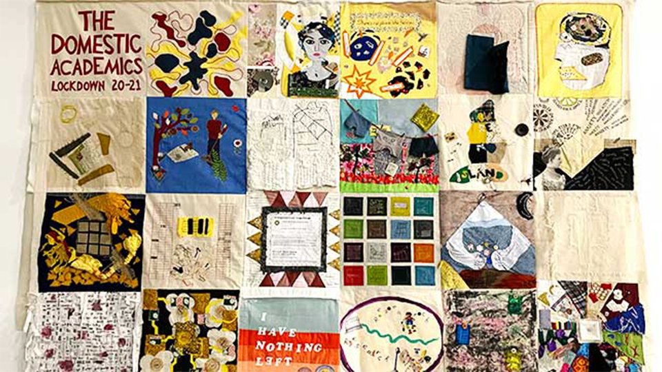 Photo of the personal stitched panels formed into one quilt from the participants of the project