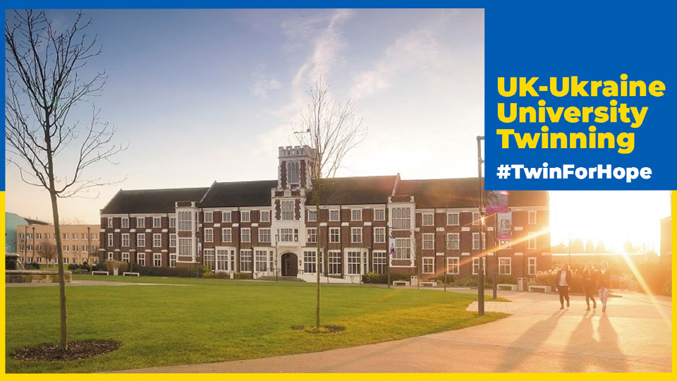 A photo of the Hazlerigg building with a blue and yellow banner and a square in the top right corner with the words 'UK-Ukraine University Twinning #TwinForHope'