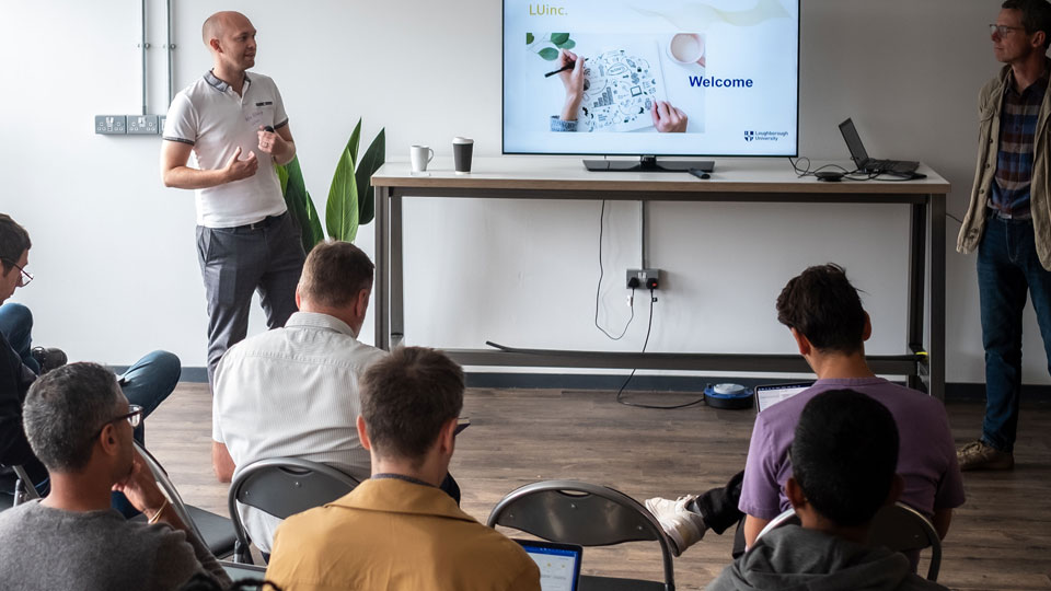 Pete Hitchings, Incubator Manager, presenting a workshop - photo taken from the back of the room, looking over the participants' heads