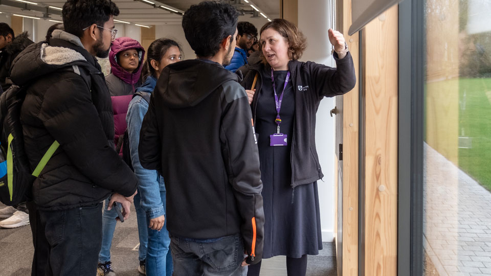 Students looking around the new Passivhaus development