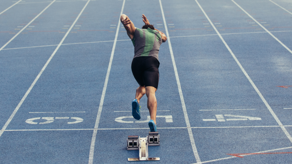 a man on the starting blocks in athletics 