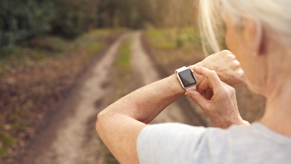 a woman checking her smartwatch