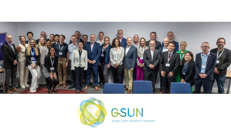 Group of people standing together in a row with the GSUN logo underneath. 