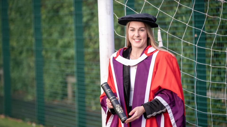 Mary Earps holding an honorary degree case