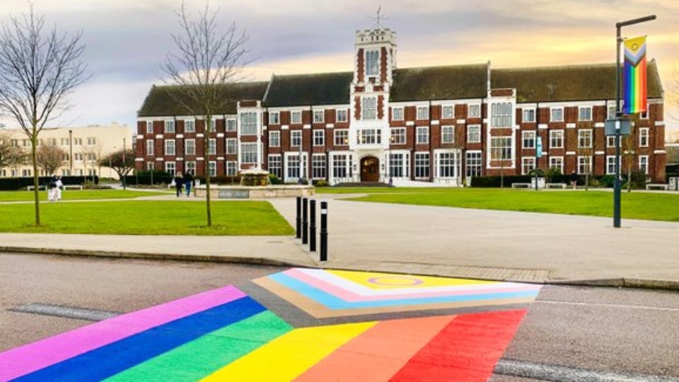 A LGBT+ rainbow crossing painted on the road opposite Hazelrigg Building on Loughborough campus.