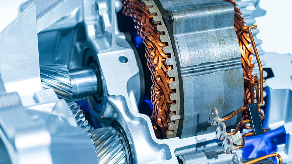 A close-up of a gear box showing intricate mechanical components