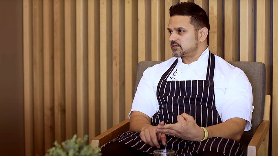 erformance Chef Varun Shivdasani sits in a chair