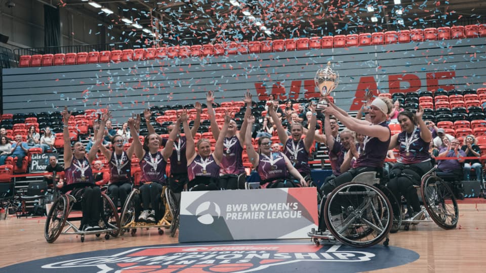 lightning basketball players lift the championship trophy