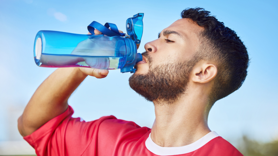 a sportsman drinking water