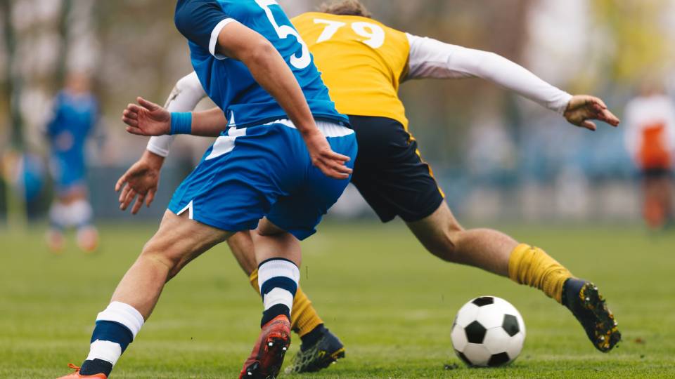 two players playing football