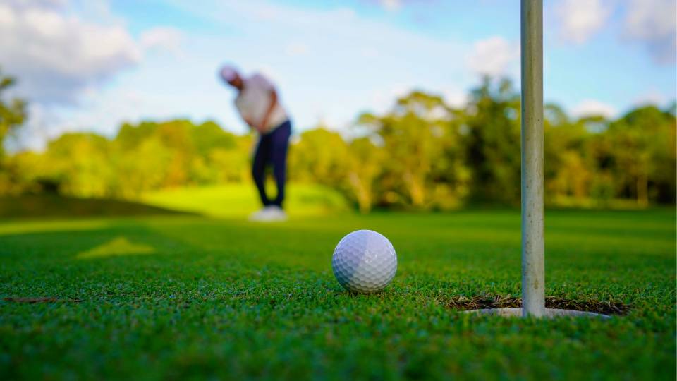 a golfer making a putt