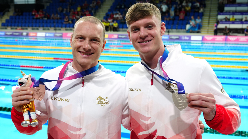Luke Greenbank with a bronze medal
