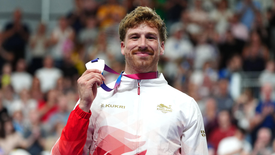 Joseph Truman of England celebrates with the silver medal following the Men's 1000m Time Trial
