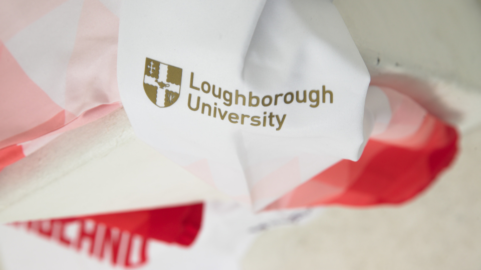 a close up of Loughborough University's logo on team england's kit