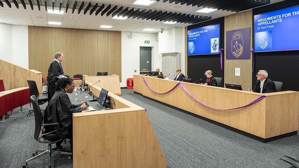 People taking part in a demonstration moot in the new moot court facility