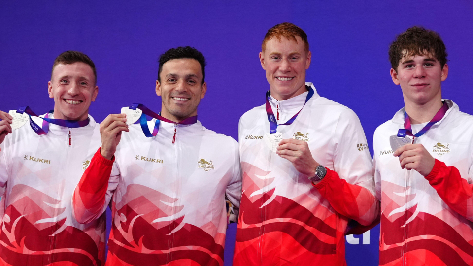 Max Litchfield holds his silver medal