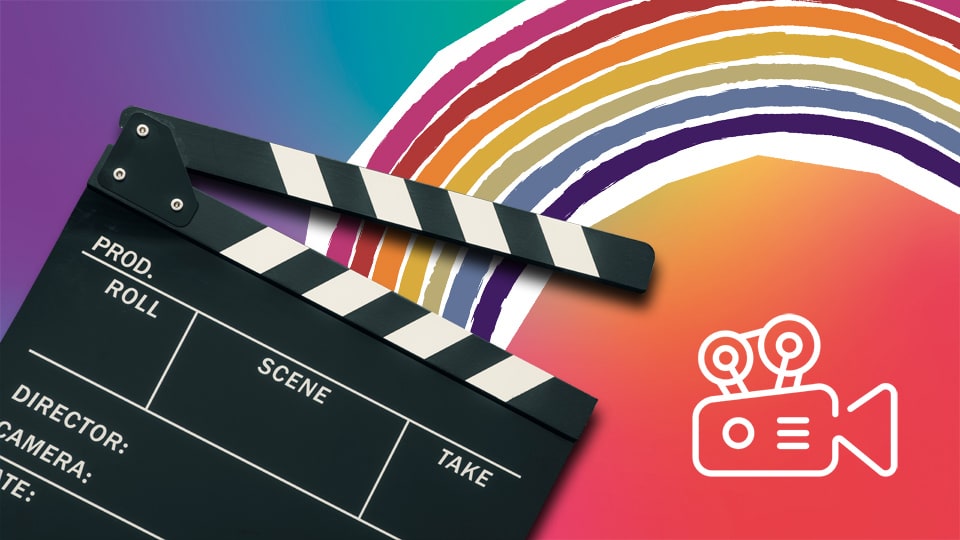 A director's clapperboard laying on a rainbow background with a video camera logo next to it