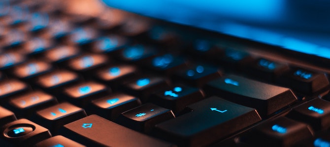 Image of a computer keyboard with blue lights