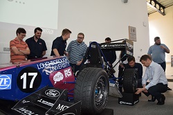 Formula student group next to the car