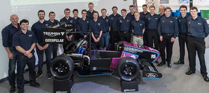 students standing around the Formula Student racing car