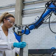 a student using the 3D concrete printing machinery