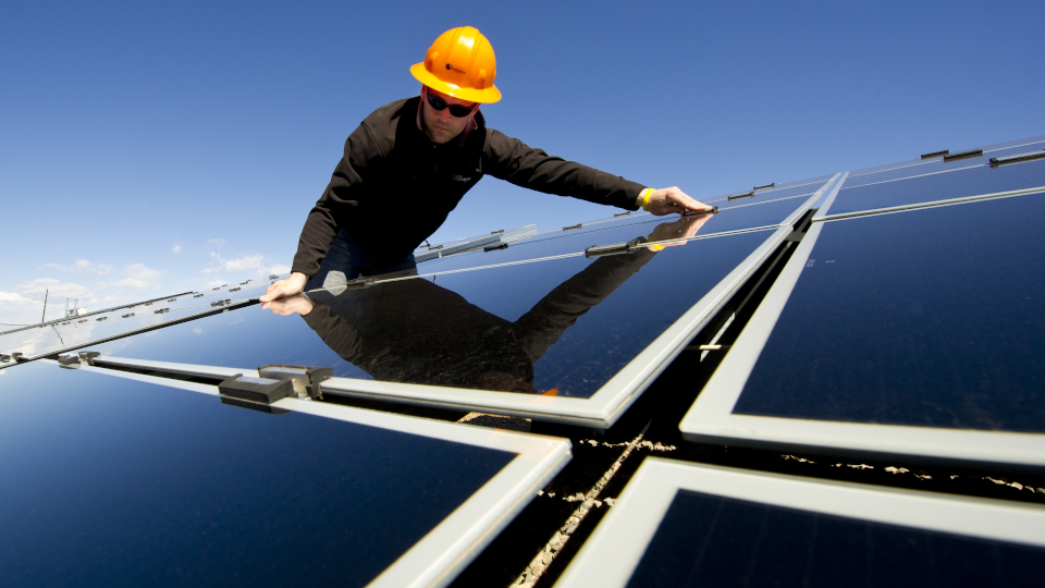 Man installing solar panels