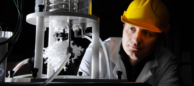 Image of student in lab growing crystals.