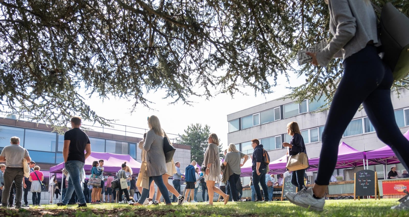 A photo of people walking outside EHB on open day