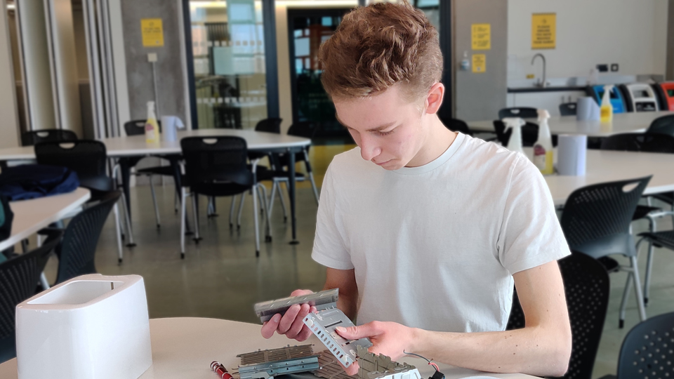 Eddie Carrington sat at a desk working on a project